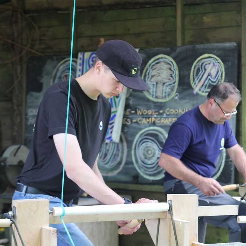 A student working at a pole lathe at Eyam Edge Farm